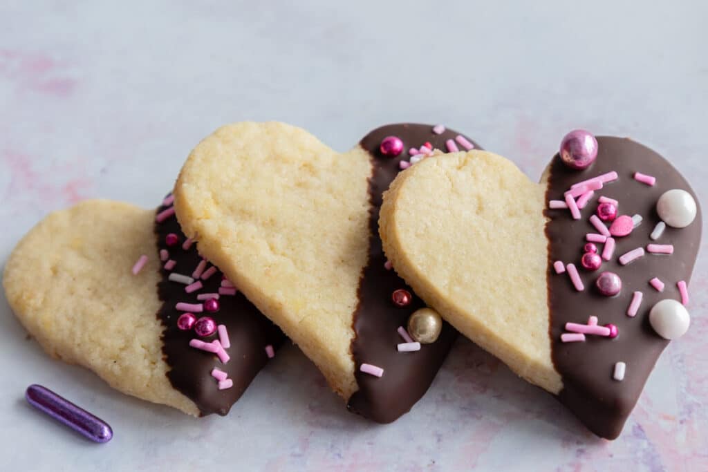 Three valentine cookies leaning.