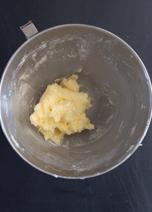Sugar and butter creamed in mixing bowl.
