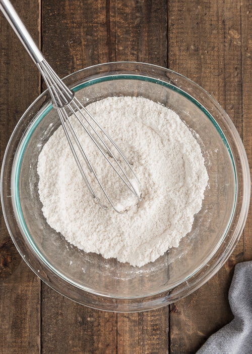 The dry ingredients whisked in a glass bowl.