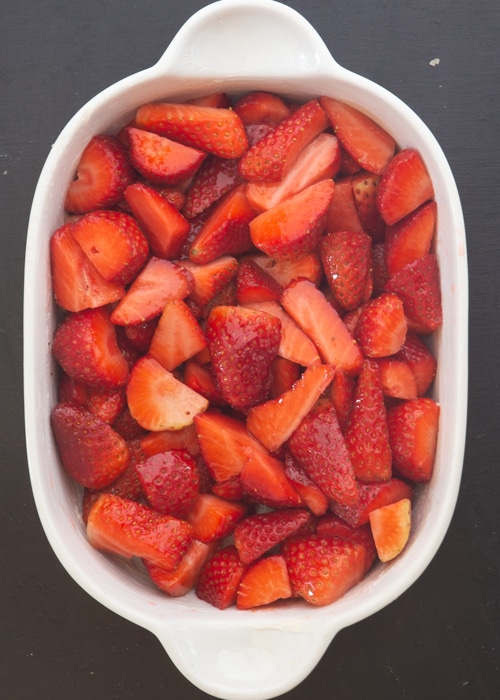 The strawberries in the baking dish.