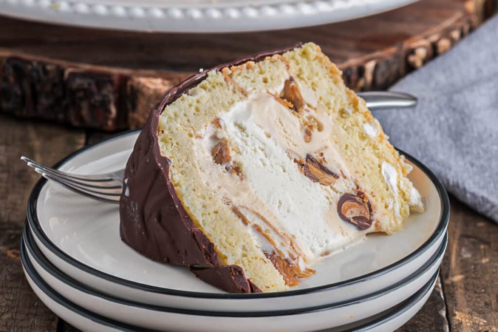 A slice of cake on a white plate.