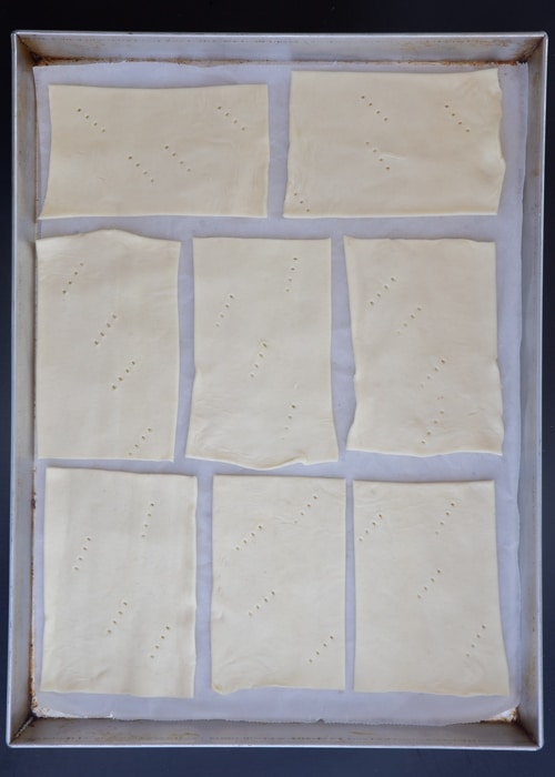 The puff pastry cut into squares.