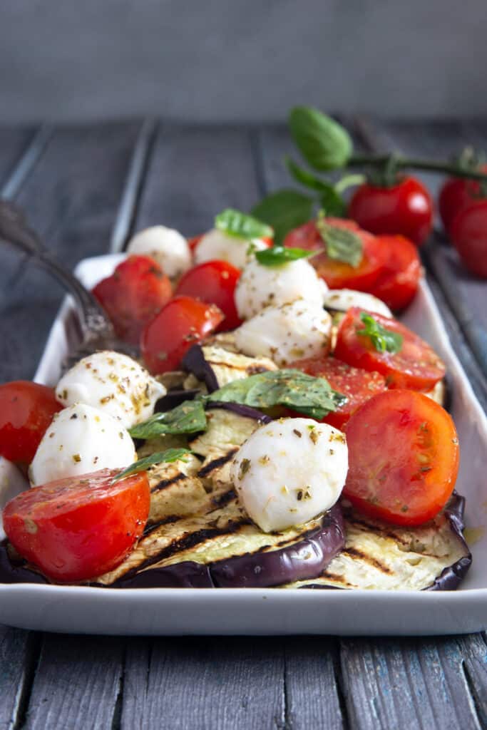 caprese on a white plate.