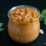 red pepper pesto in a glass jar.