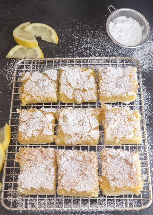 Lemon squares on a wire rack.