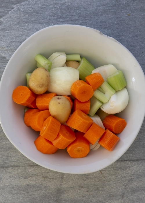 The chopped vegetables in a white bowl.
