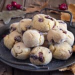 Semolina cookies on a black plate.