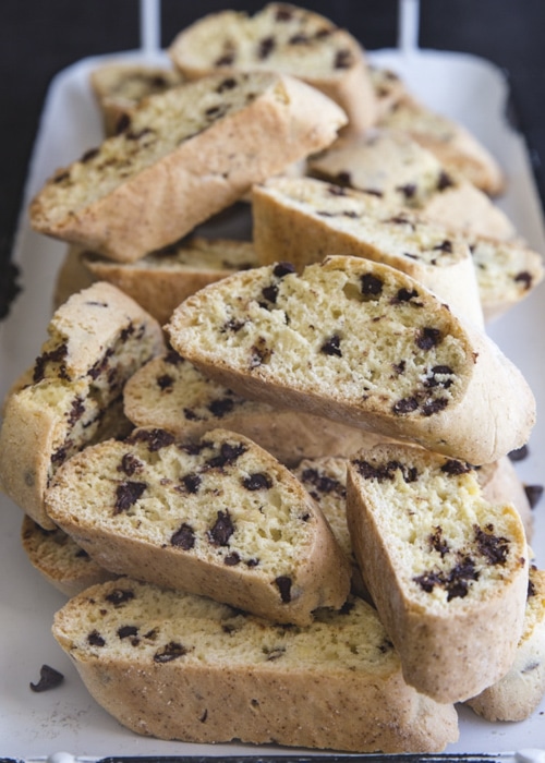 Chocolate chip biscotti on a white tray.