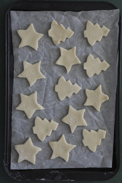 The cutout cookies on the baking sheet.