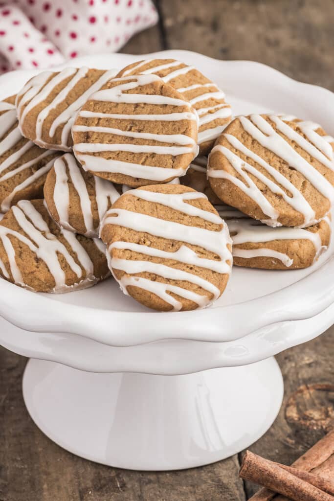 Ginger wafers on a white cake dish.