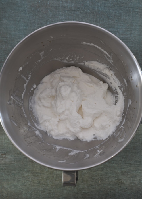 Making the whipped cream with maple syrup.