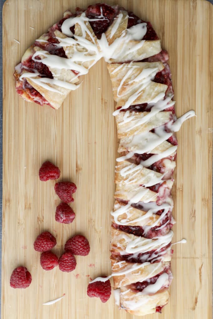 puff pastry candy cane on a wooden board.