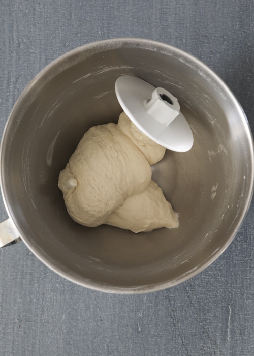 The dough mixed in the mixing bowl.