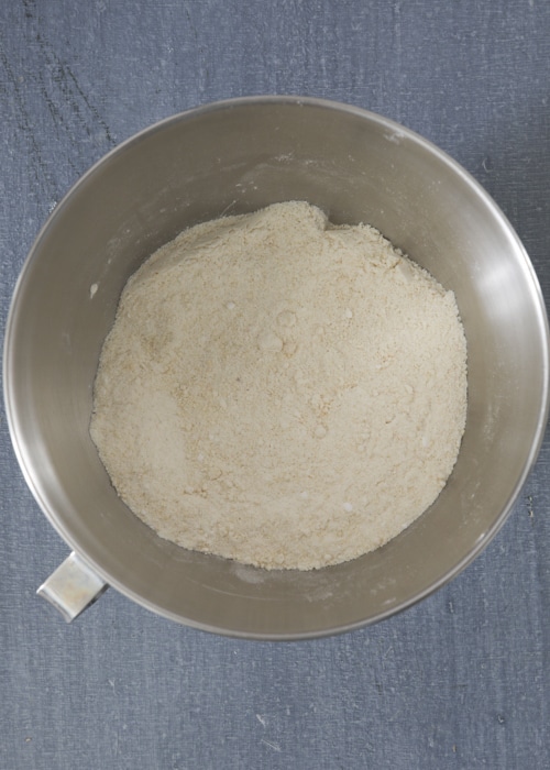 The dry ingredients whisked in a silver bowl.