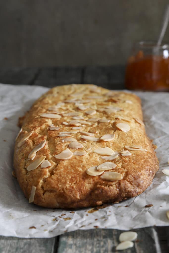 Almond roll on parchment paper.