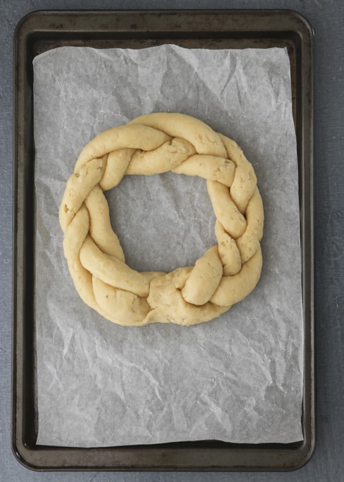 The braid formed into a circle on the prepared baking sheet.
