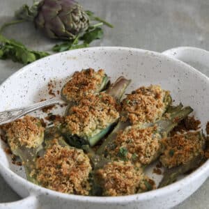 Baked artichokes in a white pan