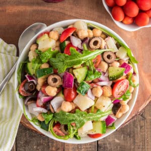 Italian salad in a white bowl.