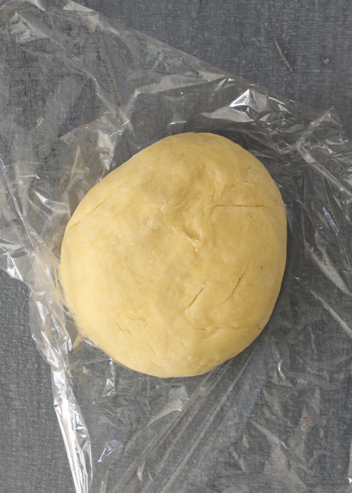 The dough on plastic wrap.