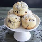 Muffins on a white cake stand.