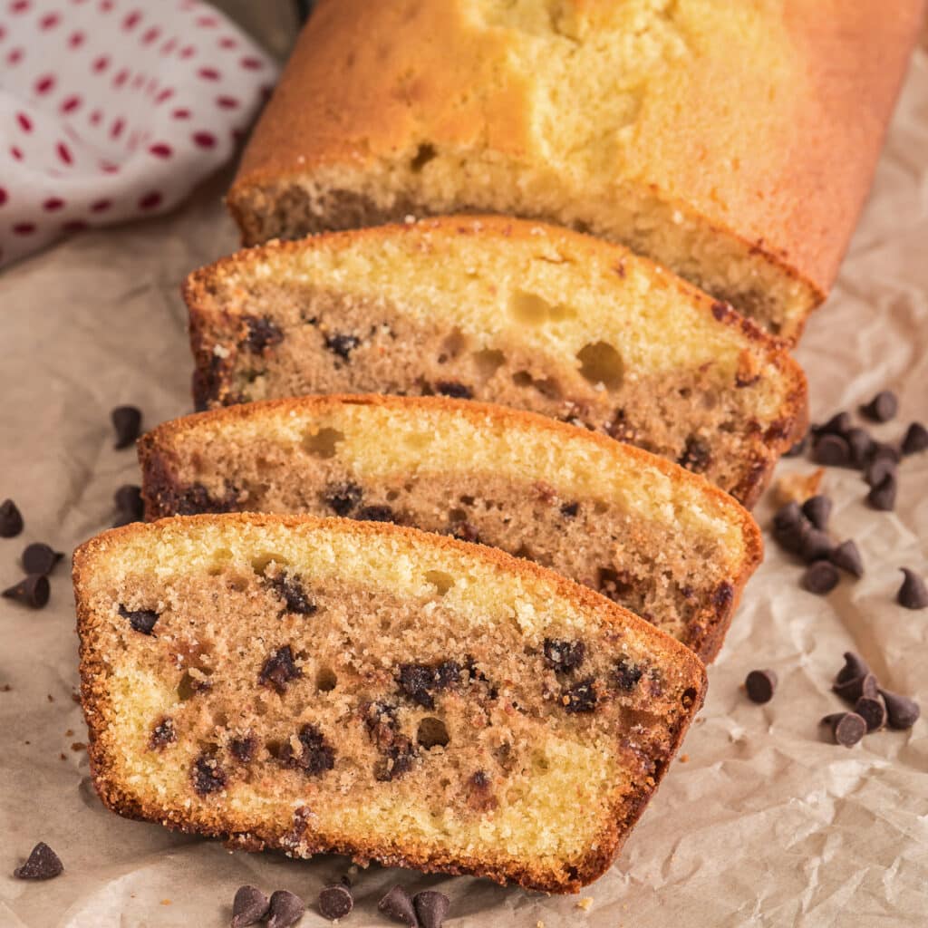 Pound cake with three pieces cut.