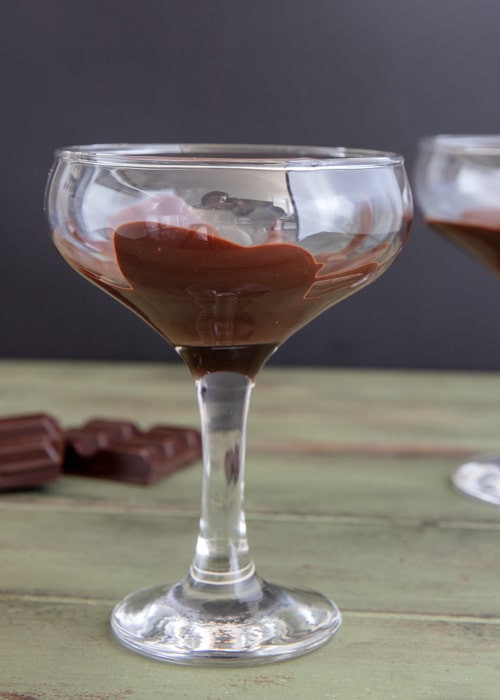 The melted chocolate in the glass.