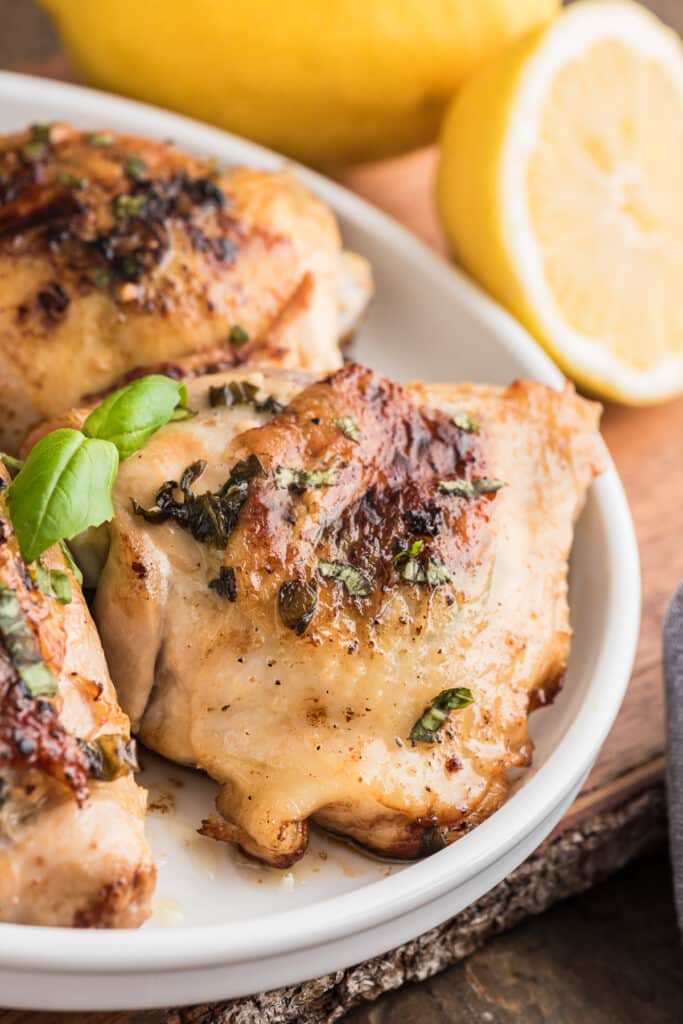 Chicken pieces on a white plate.