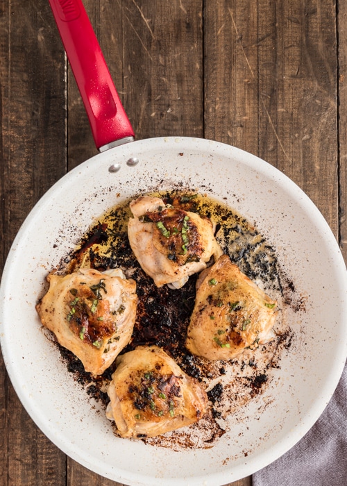 The baked chicken in the pan.