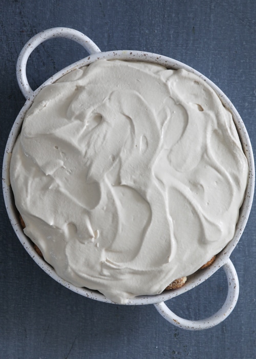 The cappuccino tiramisu in the white baking dish.