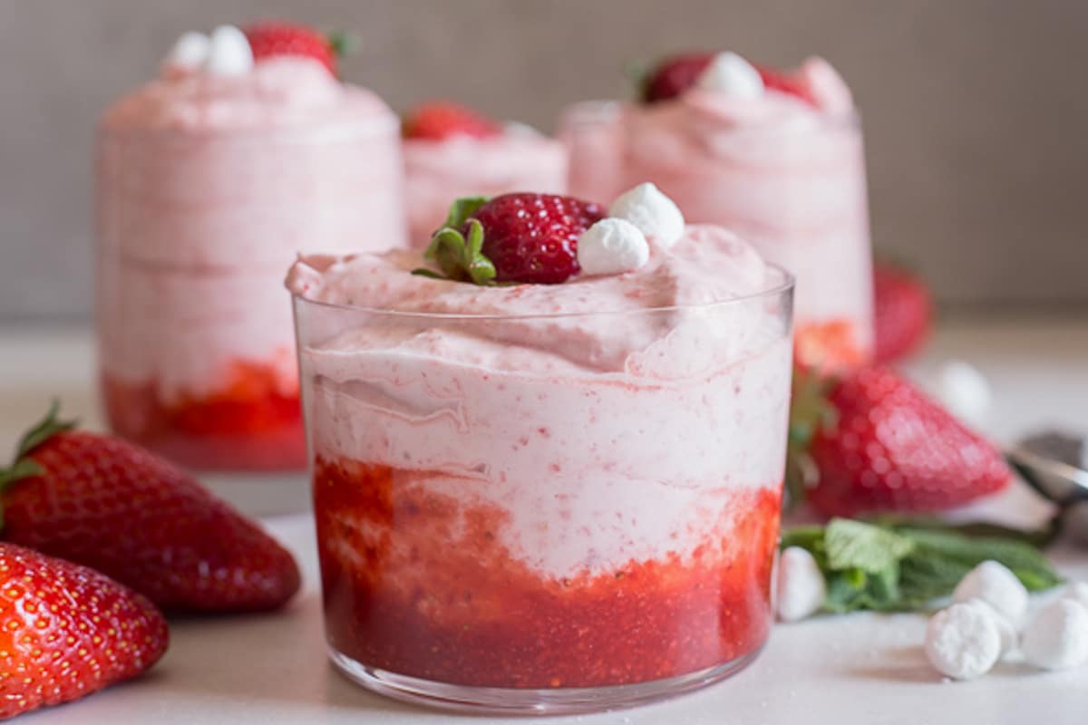 Strawberry mousse in three glasses.