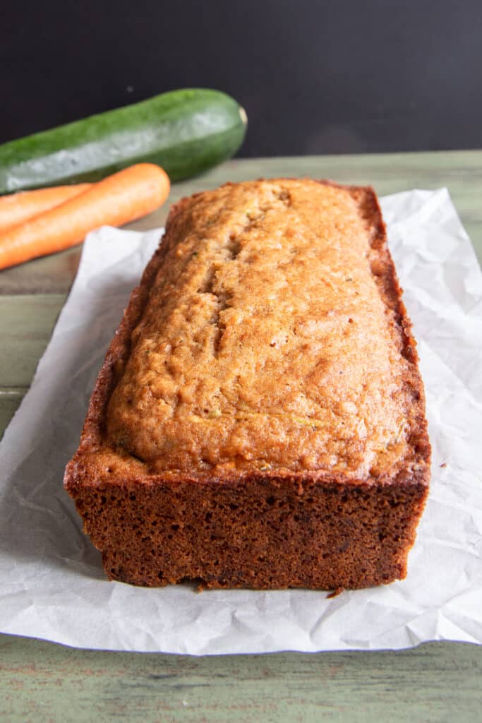 The zucchini carrot loaf on a piece of parchment paper.