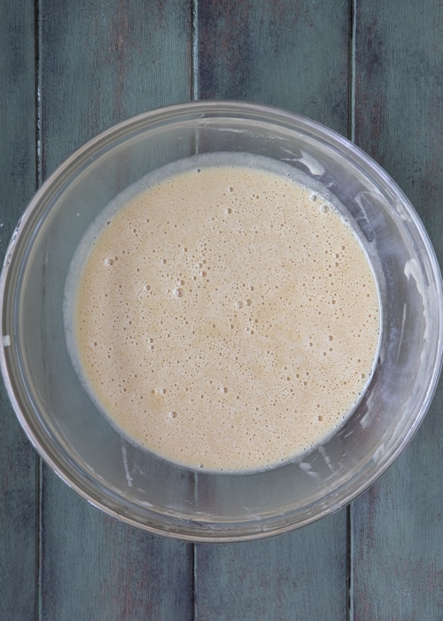 Mixing the wet ingredients in a glass bowl.