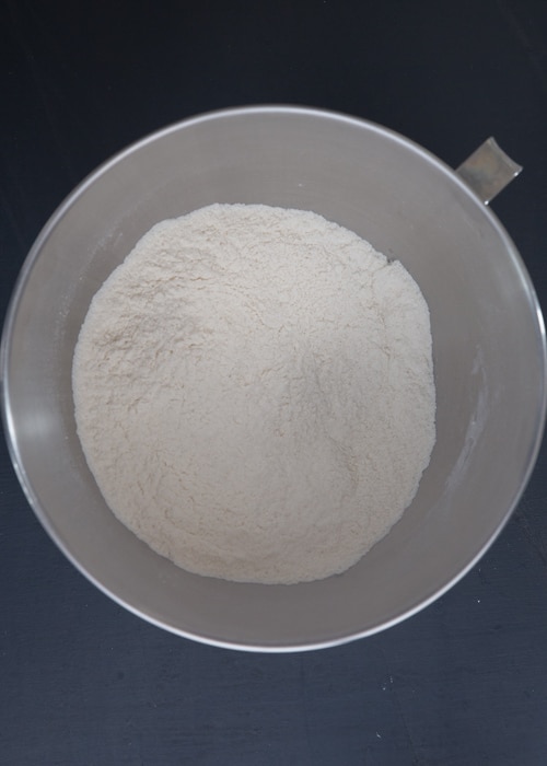 The dry ingredients whisked in a silver bowl.