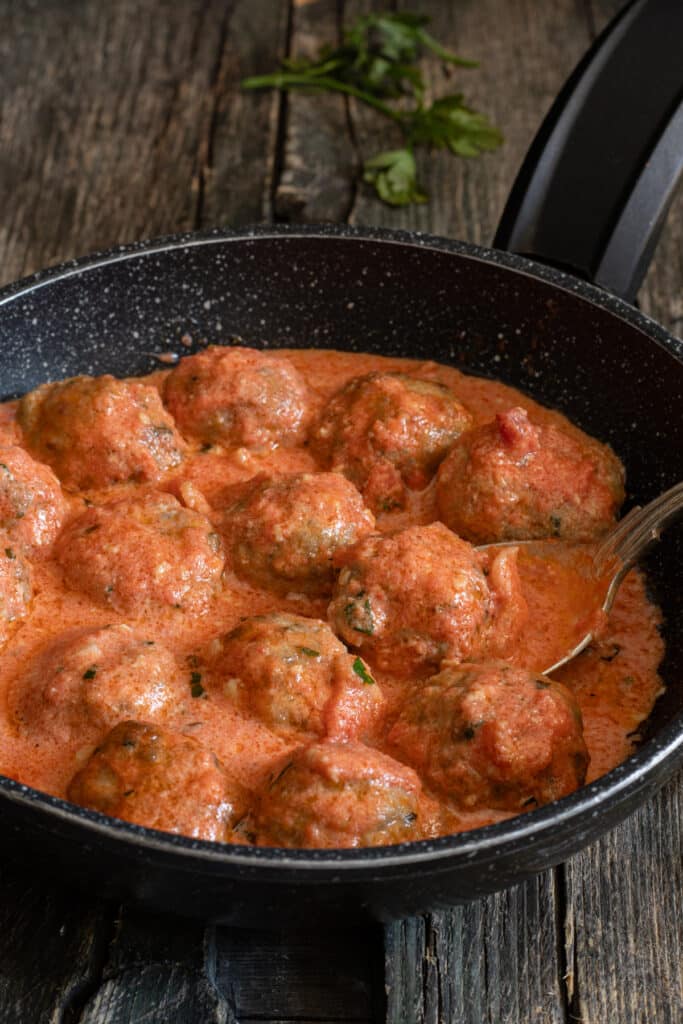 Meatballs in a black pan.