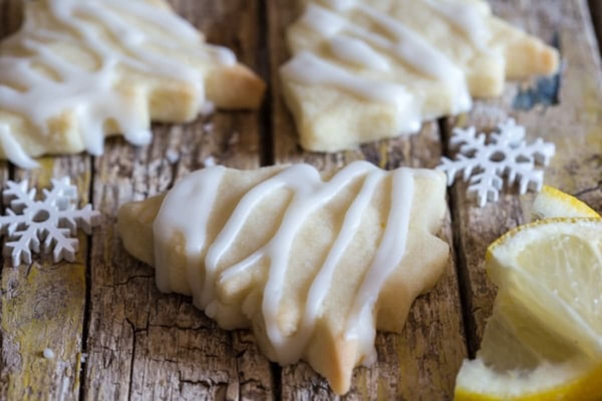 Lemon shortbread cookies on a wooden board.