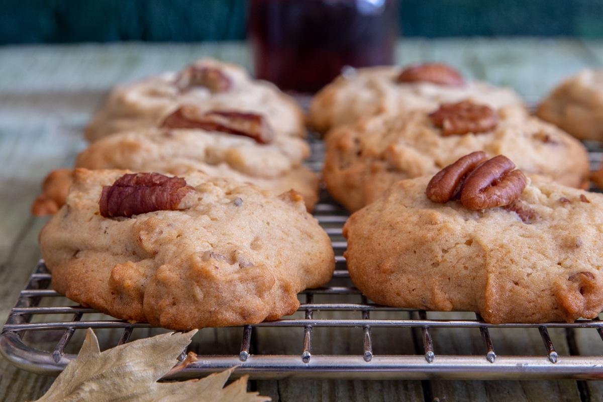 Maple cookies on a wire rack.