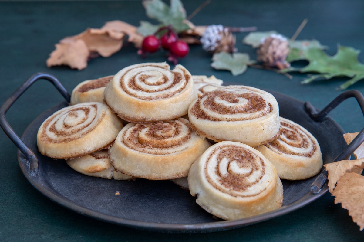 Brown sugar pinwheels on a black plate.