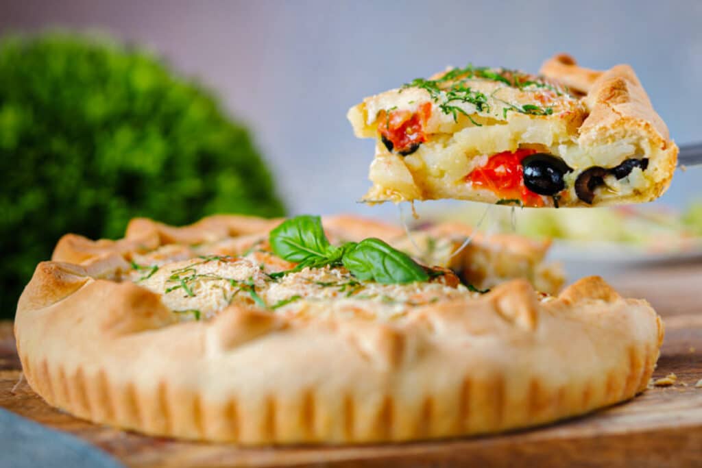 A slice of pie on a spatula.