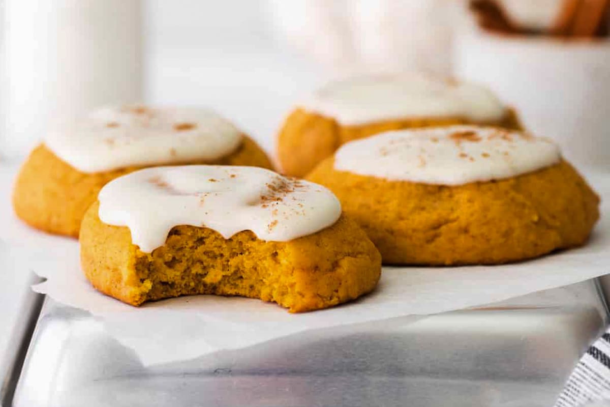 Pumpkin cookies on a white plate.