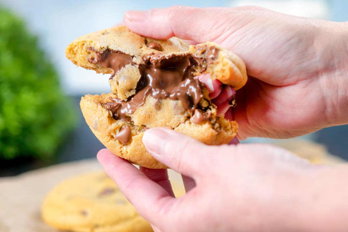 A stuffed cookie broken in half.