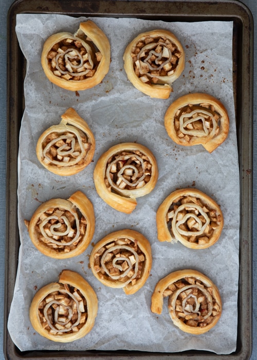 The roll ups baked on the baking sheet.