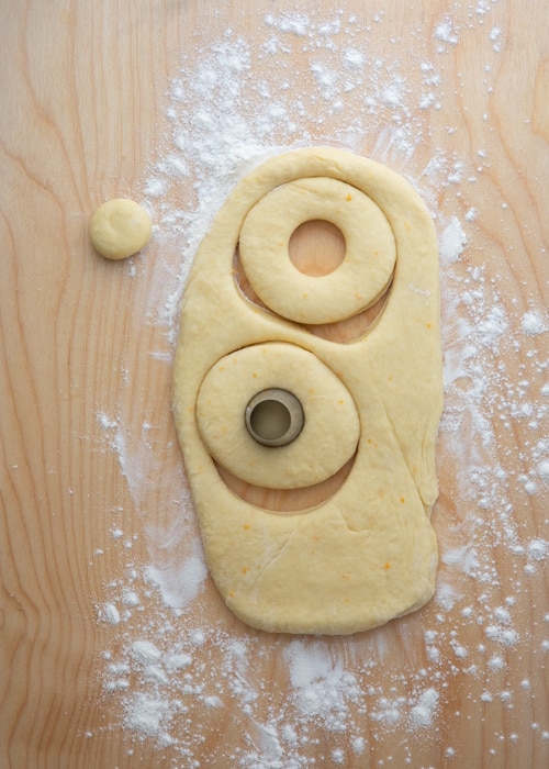 Cutting out the dough on a wooden board.