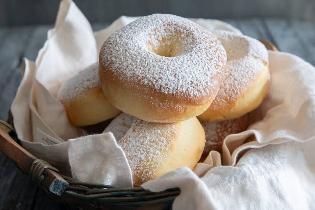 Donuts in a blue basket.