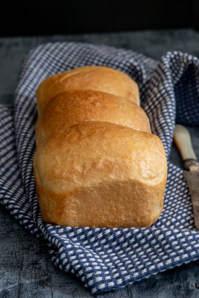 Cream bread on a blue napkin.