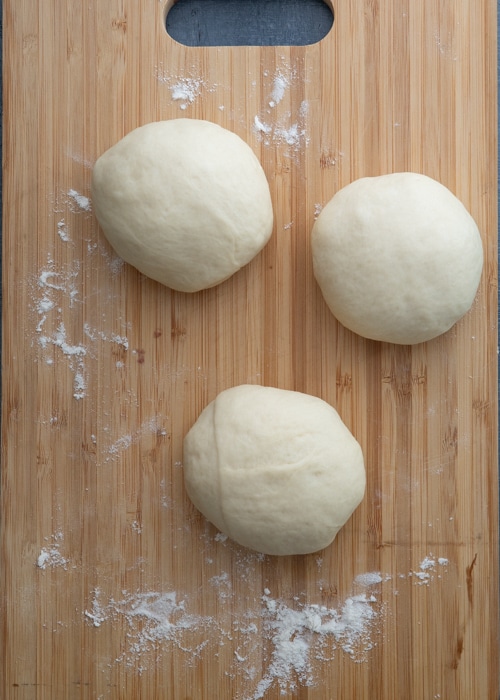 The dough divided into three balls.