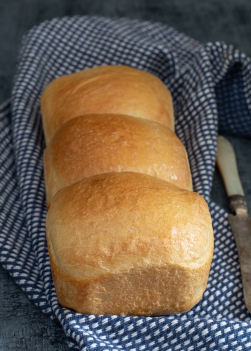 The bread after baked on a blue napkin.