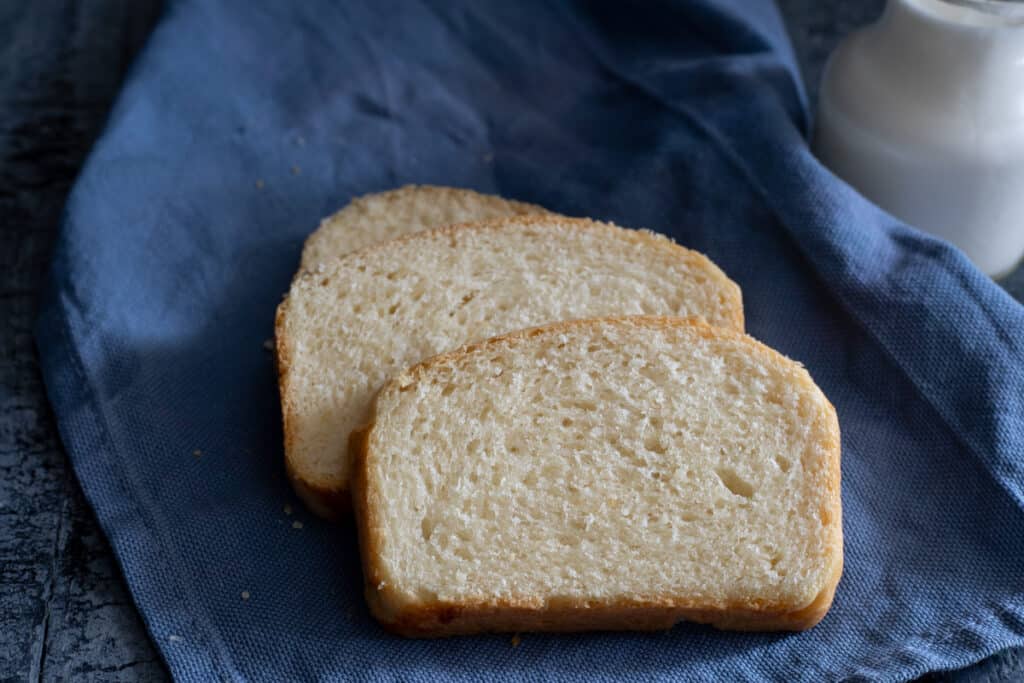 Three slices of bread on a blue napkin.