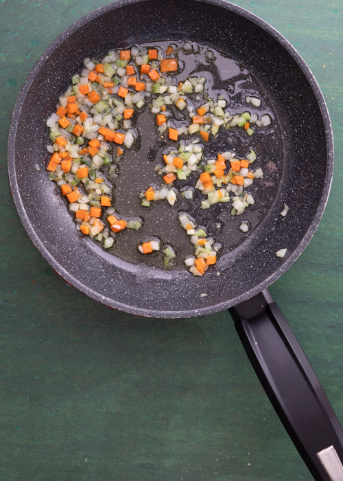 The chopped vegetables in the black pan.