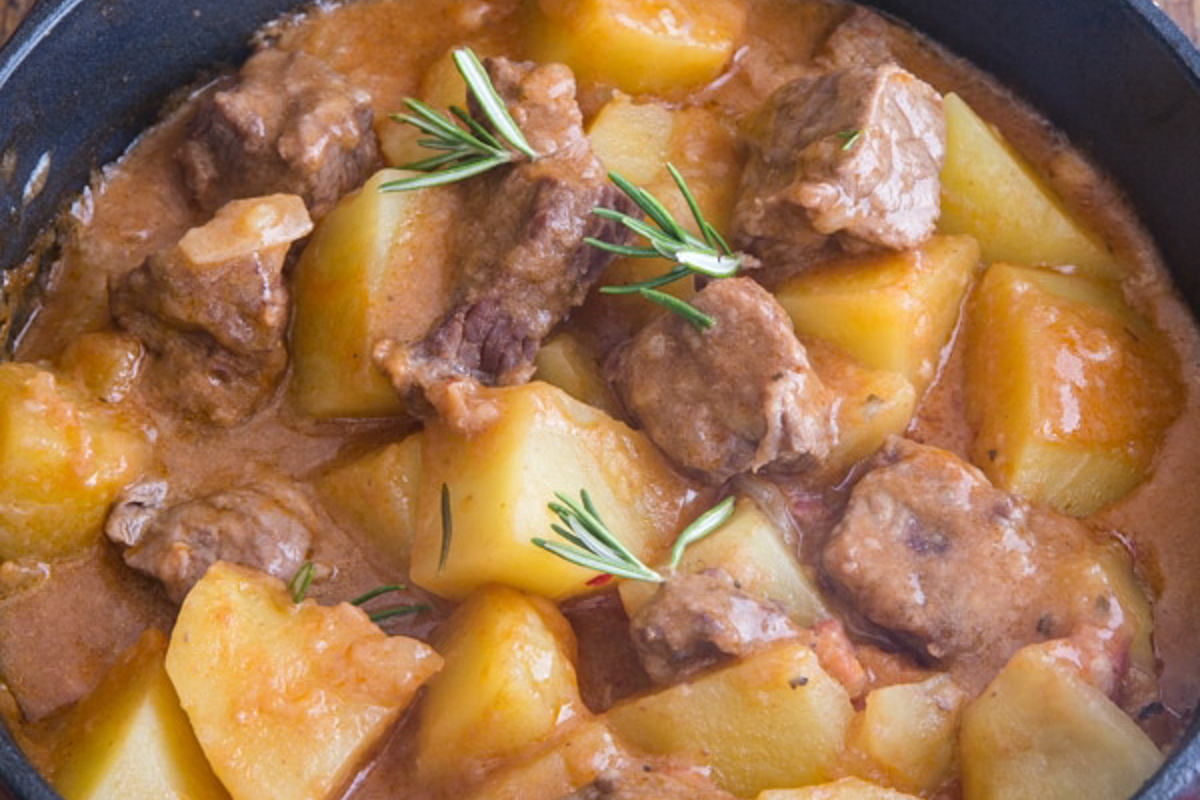 Beef and potato stew in a pot.