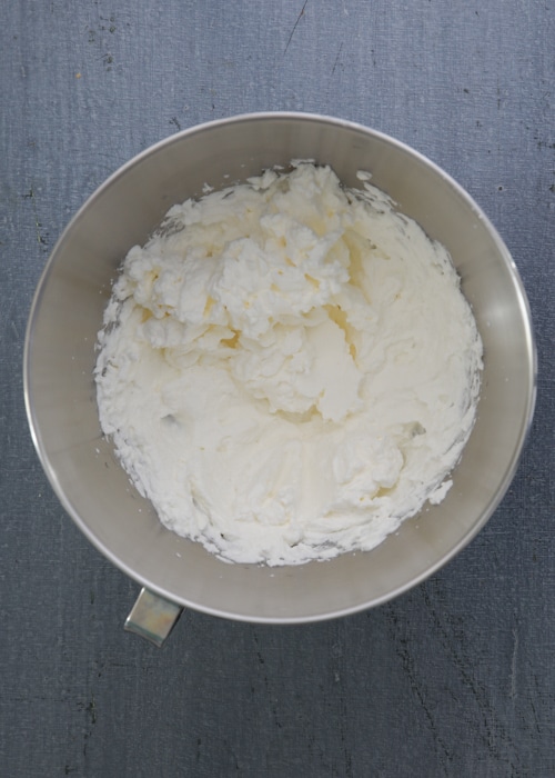 The cream whipped in the mixing bowl.